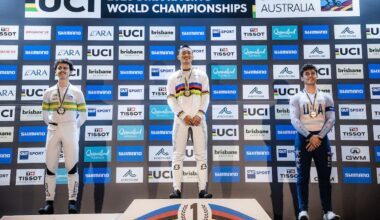 Riders standing on a podium