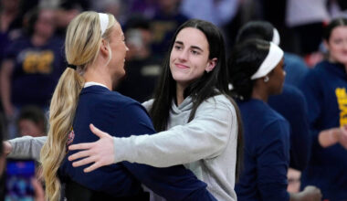 Indiana Fever guard Caitlin Clark, right, hugs Fever guard Sophie Cunningham during player intr ...