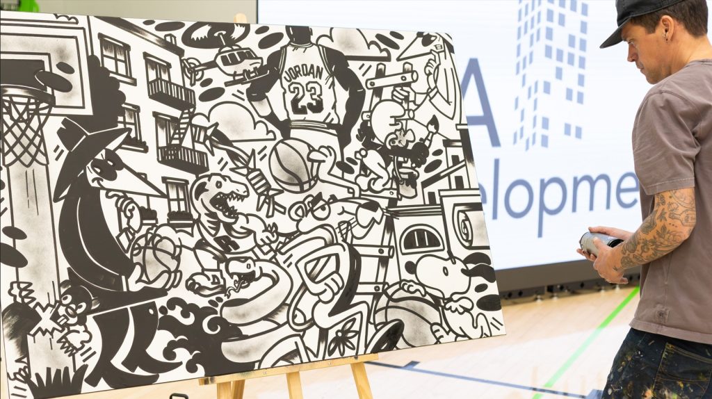 Ottawa artist Fall Down G works on a live mural throughout the event, creating a one-of-a-kind piece that was later auctioned to support CHEO's NICU.