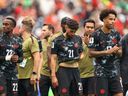 Jonathan Osorio (No. 21) and other Canadian players show dejection after the team's 0-3 defeat in the FIFA World Cup 2026 Round of 16 match between Canada and Morocco at Houston Stadium on July 4, 2026.