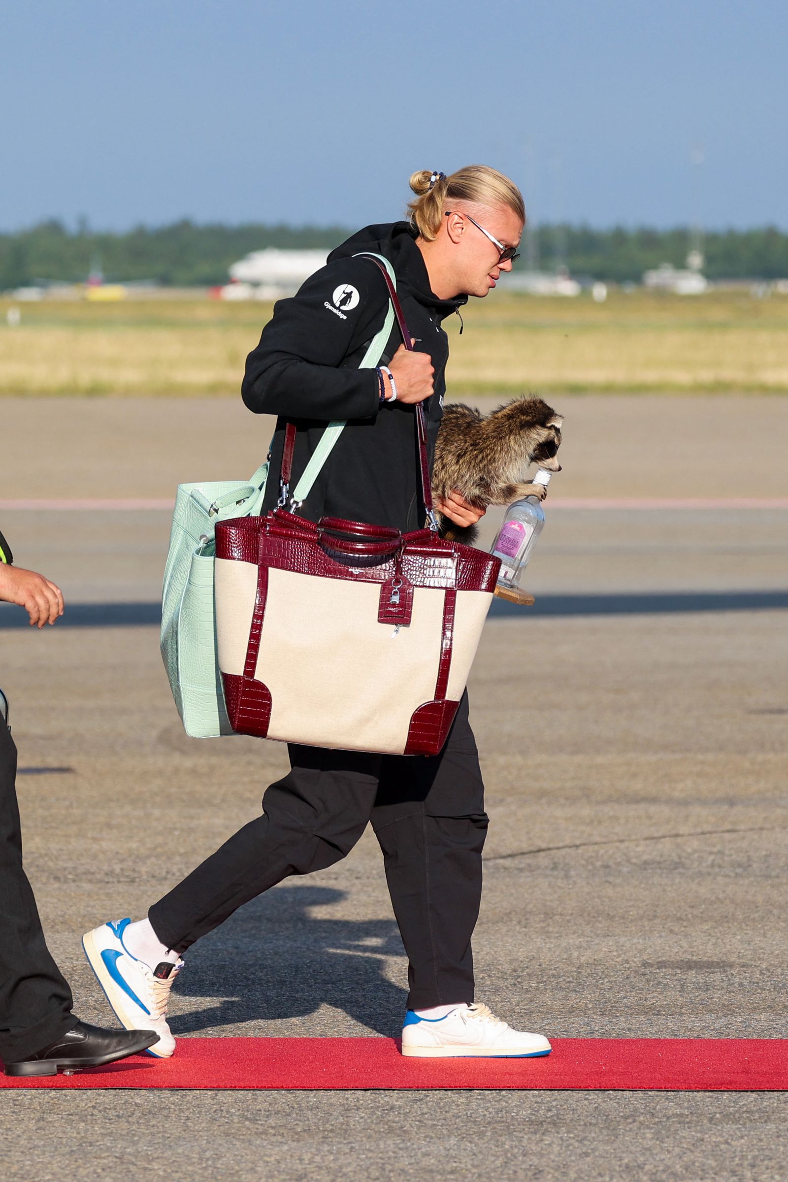 Norway's striker Erling Braut Haaland is pictured after getting off the plane as the Norway's national football team...