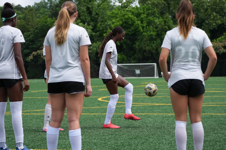 Makenna Johnson warms up with other players ahead of tryouts at Riverline Park in Mableton, Georgia, on May 27, 2026. 