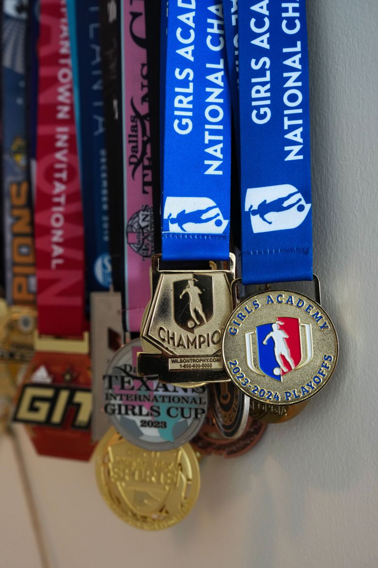 Various medals hang in Makenna Johnson’s room in Duluth, Georgia, on May 27, 2026. 