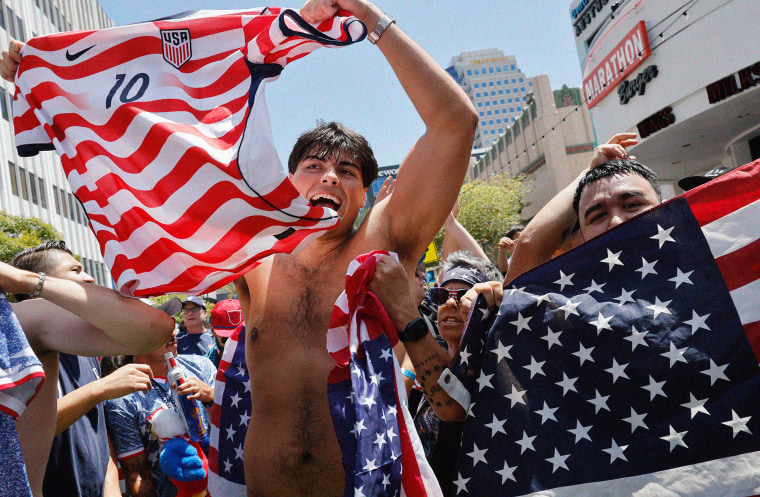 U.S. soccer fans celebrate at a watch party on June 19 in Long Beach, CA after the U.S. defeated Australia. 