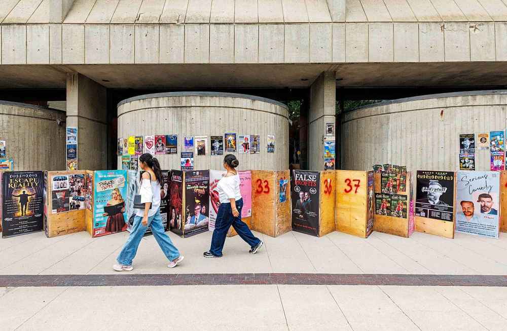 MIKE DEAL / FREE PRESS
Fringe festival posters and sandwich boards line the sidewalk along Market Avenue beside the Royal Manitoba Theatre Centre.
