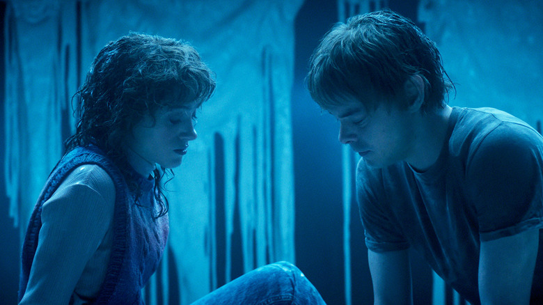Natalia Dyer's Nancy Wheeler sits opposite Charlie Heaton's Jonathan Byers in a melting room in Stranger Things