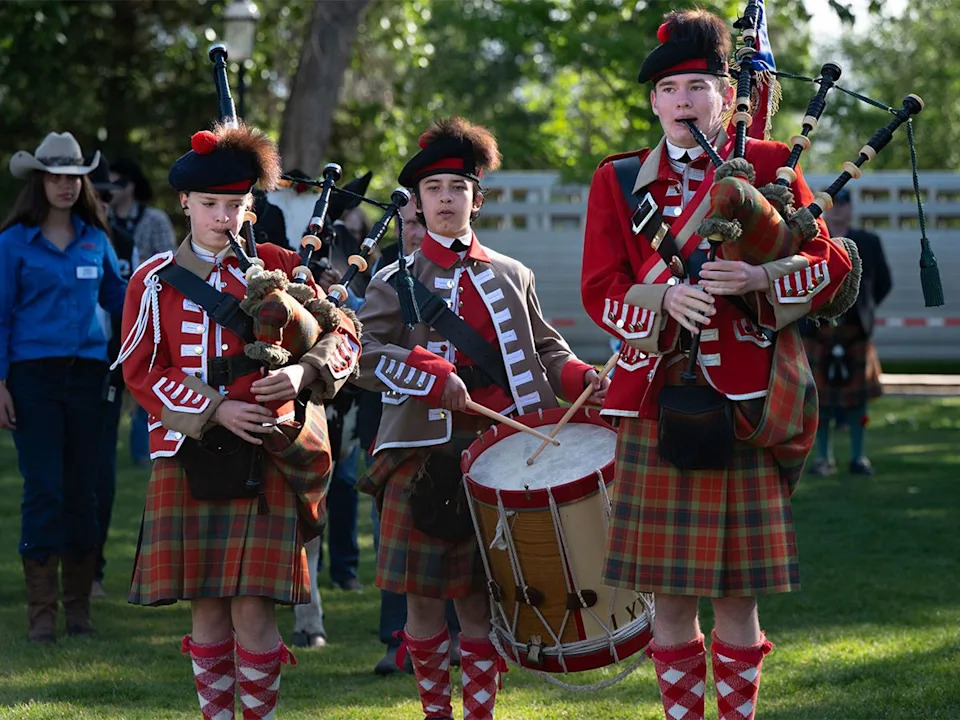 Bagpipes welcome Wendy the cow in preparation for concocting the Trail Boss Tonic at the Legacy Stampede Breakfast at Heritage Park in Calgary on Sunday, July 5, 2026.