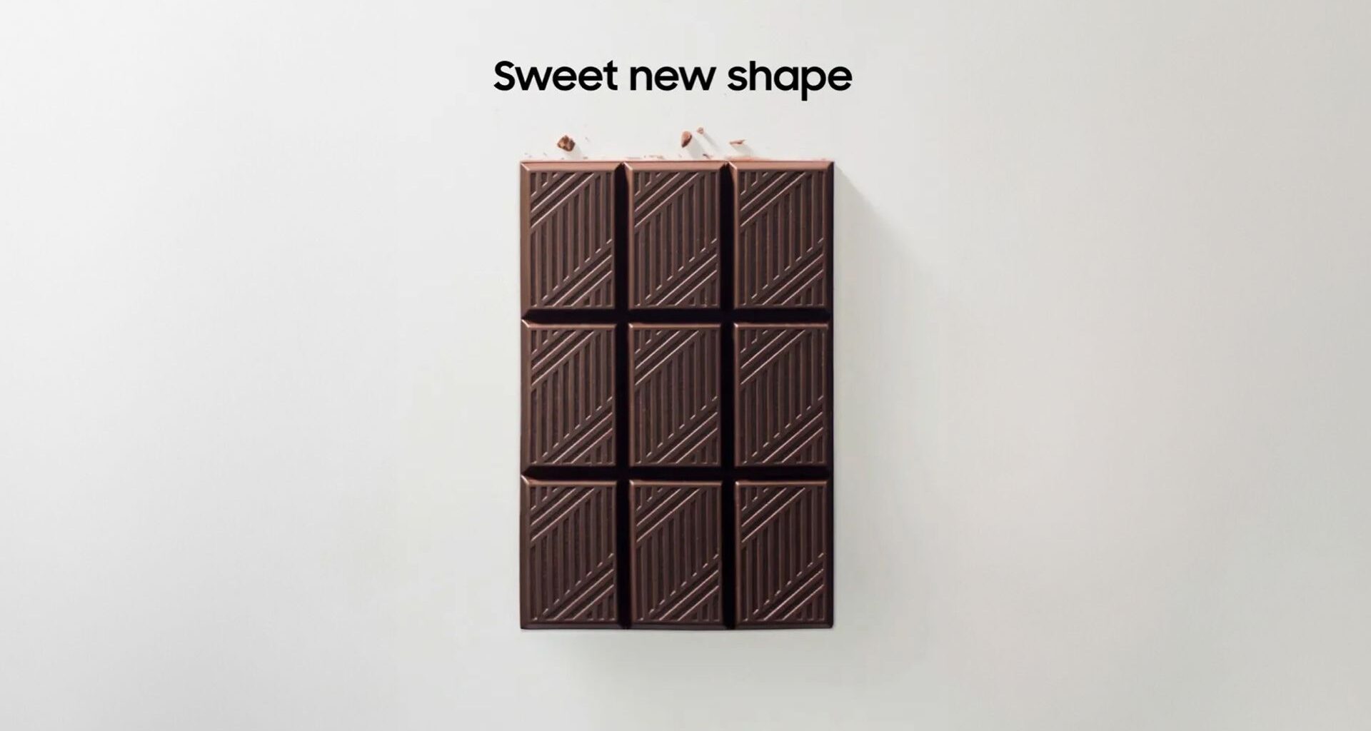 Samsung social media teaser of a chocolate bar with text reading "sweet new shape"