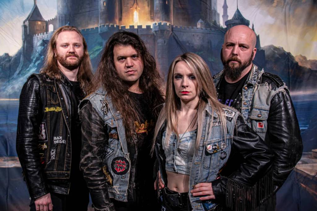 The members of the Iron Kingdom metal band. From left to right, Max Friesen (drummer), Chris Osterman (lead guitar, lead vocals), Megan Merrick (lead guitar), and Leighton Holmes (bass guitar). (Photo submitted by Iron Kingdom)