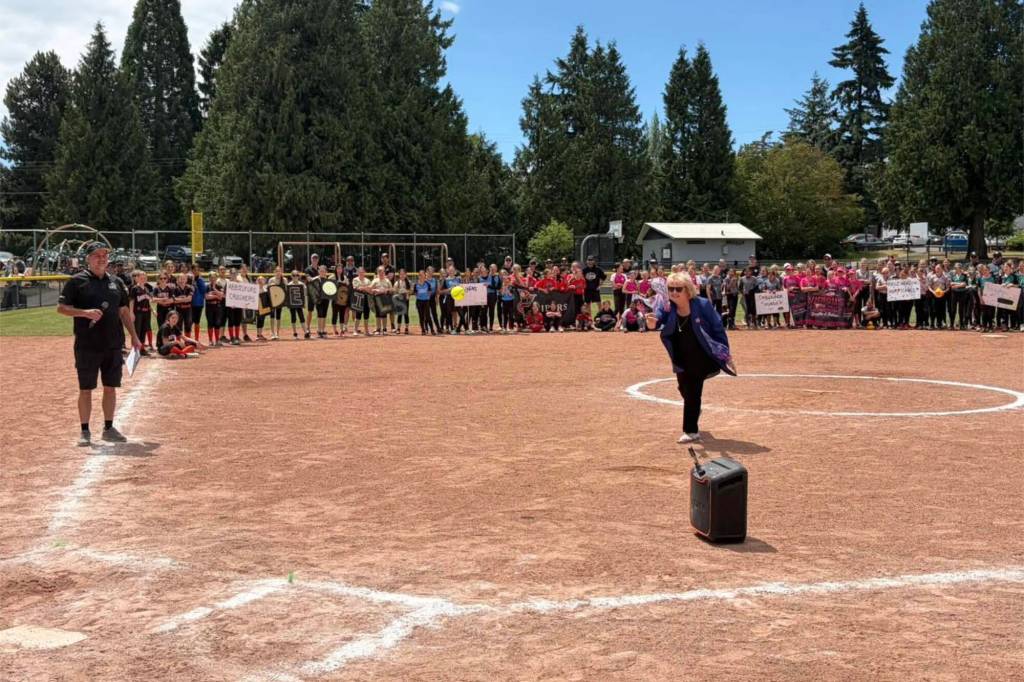 Surrey Mayor Brenda Locke throws the ceremonial first pitch to open the Softball BC U13 regional softball tournament at Sunnyside Park in South Surrey over the weekend. (Contributed to Peace Arch News)
