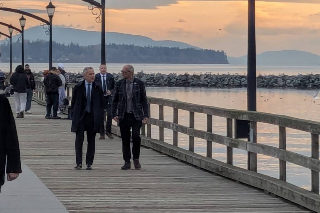 Prime Minister Mark Carney and South Surrey-White Rock MP Ernie Klassen walk the pier during the Prime Minister&rsquo;s brief visit to White Rock on Nov. 12, 2025. (Alex Browne/Peace Arch News)
