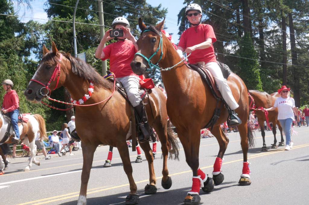 The Silver Spur Riding Club walk down the Island Highway during the Parksville Canada Day Parade on July 1. (Kevin Forsyth photo)