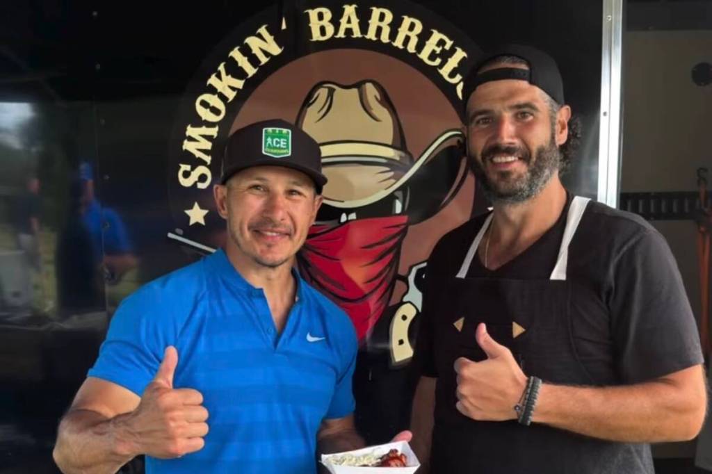 Former NHLer Jordin Tootoo, pictured here with Taylor Hughes from Smokin&rsquo; Barrels BBQ, was one of the celebrities who participated in the 11th Moj Shootout at the Harvest Golf Club in Kelowna on June 29, 2026. (Bob Marjanovich photo)