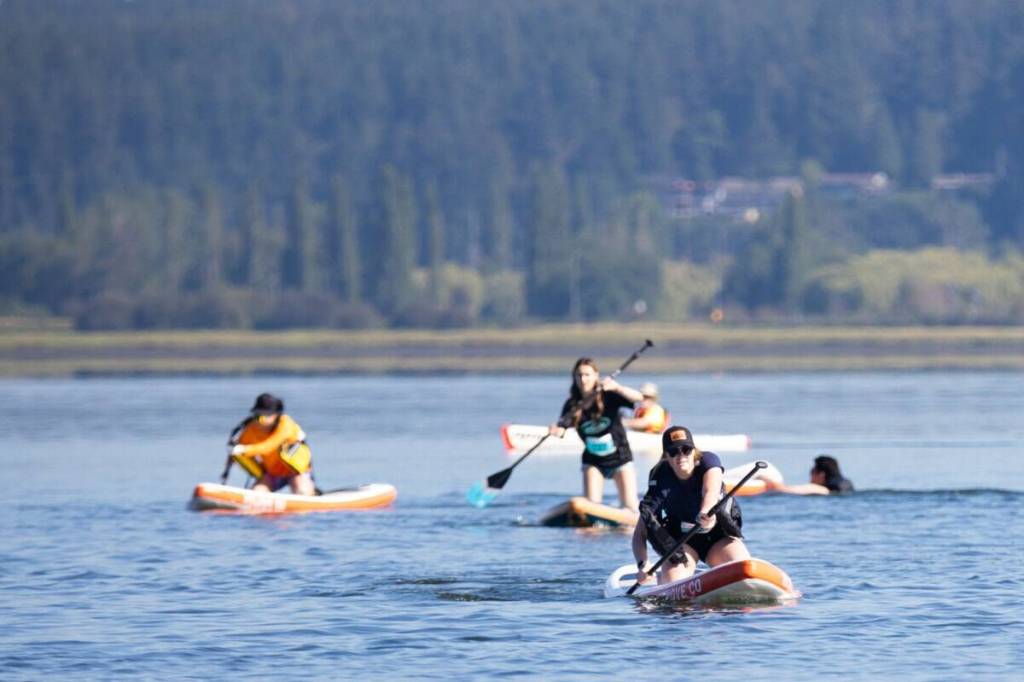 Sophie Michael from Surrey Fire SUPerstars team paddling in group a, race 1 at the 2024 Surrey Hospitals Foundation Champion of Crescent at Blackie Spit Park in South Surrey. The annual fundraiser in support of child and youth mental health returns July 23 this year. (Anna Burns/Surrey Now-Leader)