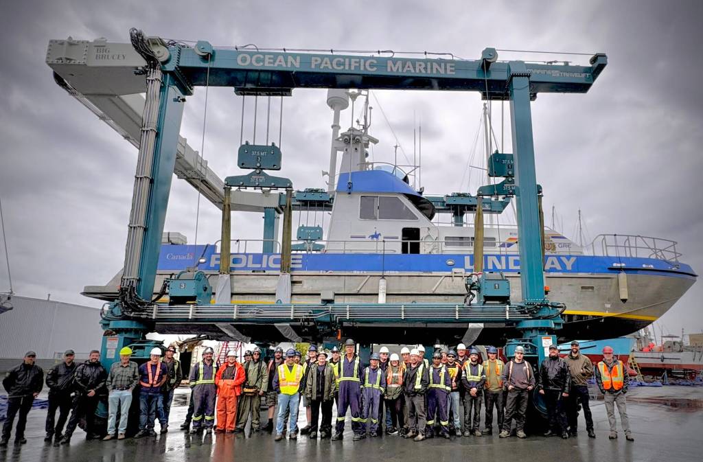 The Ocean Pacific Marine team with an RCMP vessel they previously worked on. (Laura Kempling/Contributor)
