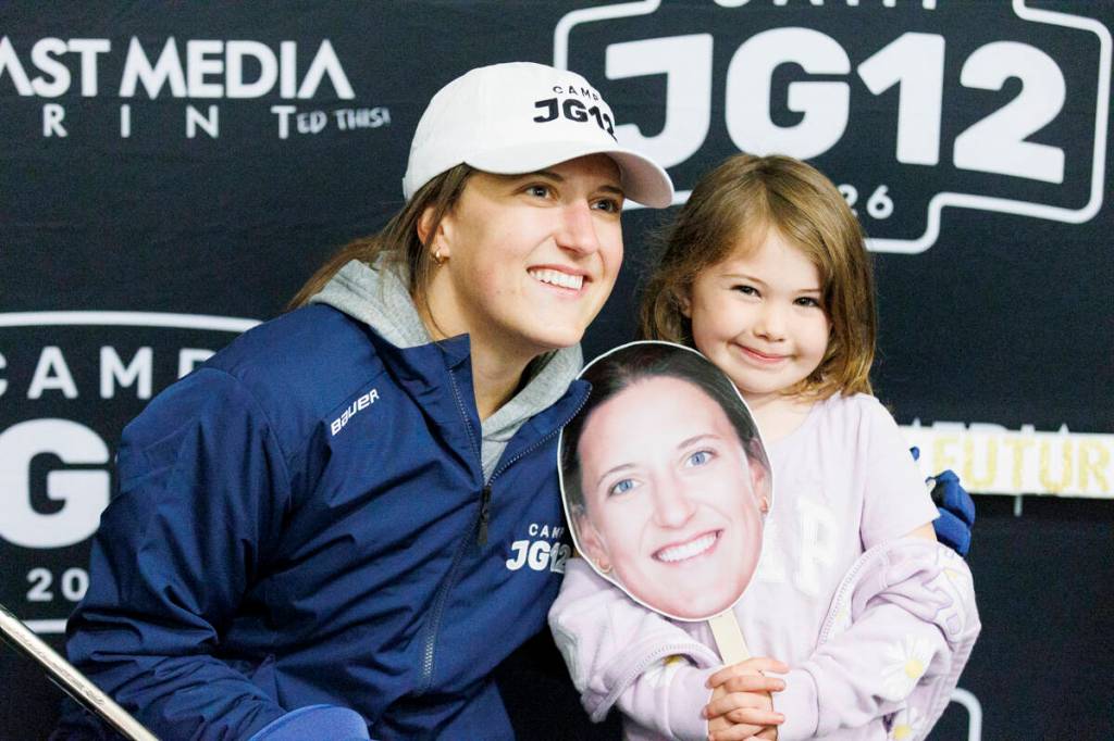 A young girl poses for a photo with Jenn Gardiner at JG12 hockey camp at Surrey Sport & Leisure Complex in Surrey on Friday, July 3, 2026.(Anna Burns/ Surrey Now-Leader)