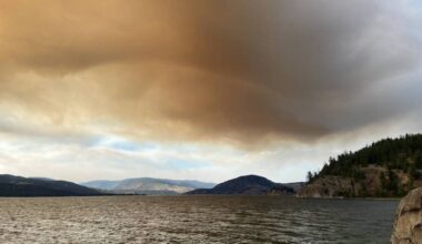 Smoke rising above the hills on the west side of Okanagan, causing by a wildfire burning near Boston Bar. (Jennifer Smith/ Vernon Morning Star)