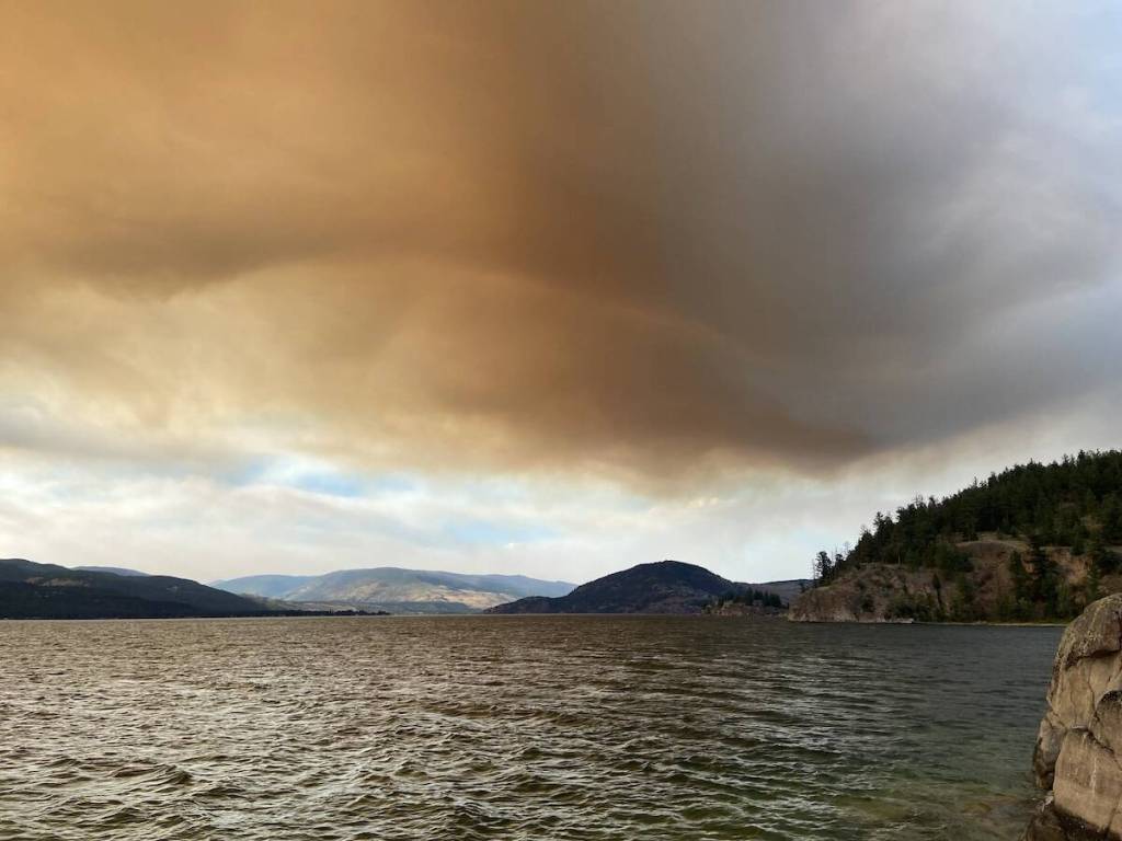 Smoke rising above the hills on the west side of Okanagan, causing by a wildfire burning near Boston Bar. (Jennifer Smith/ Vernon Morning Star)