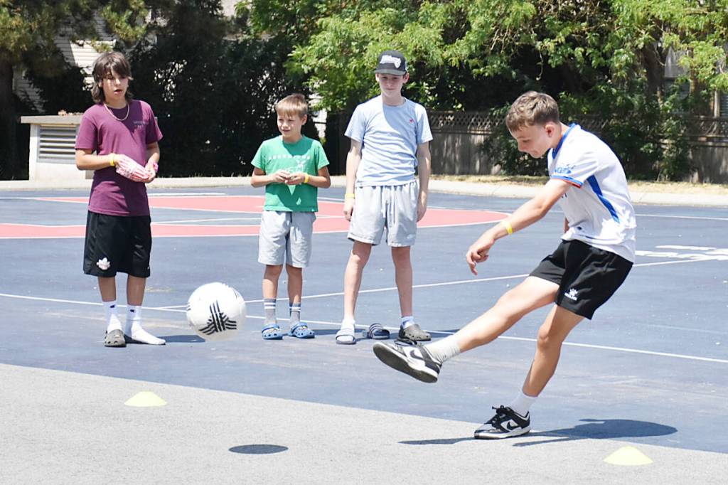 Boys take turns trying for the fastest shot on net during World Cup fun at the Pitt Meadows Recreation Centre on Wednesday, June 24. (Colleen Flanagan/The News)