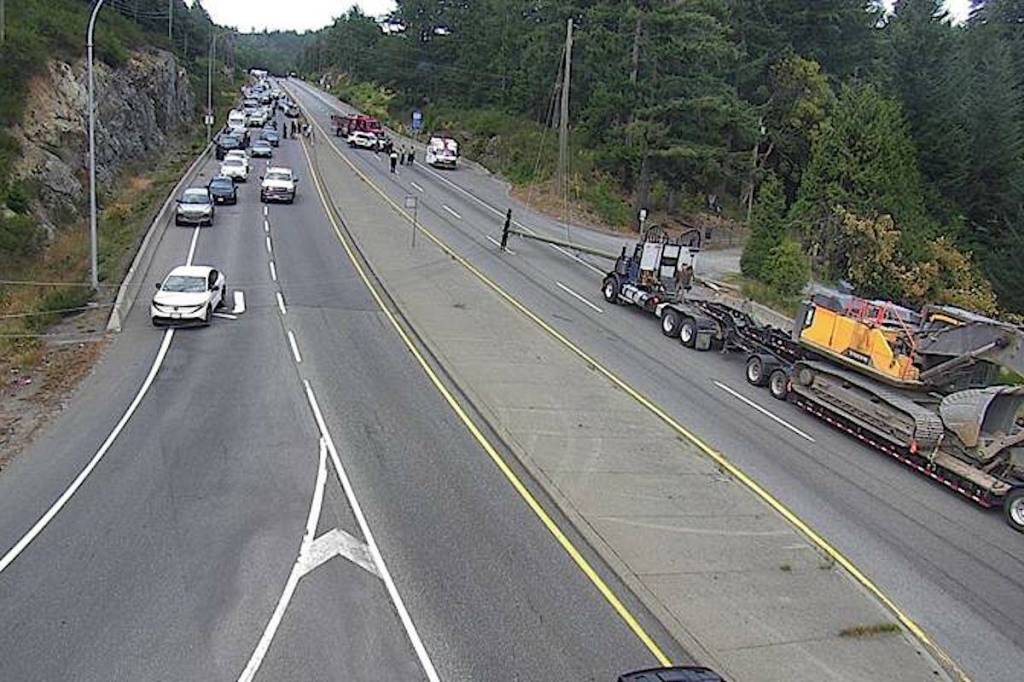 Drive BC cameras show a downed power line in the northbound lane at Shawnigan Lake Road, with cars backed up in north- and southbound lanes. (Drive BC)