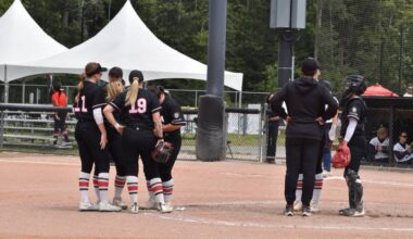 Team Canada confers during their game vs. Czechia Thursday (July 9) in South Surrey’s Softball City, which Canada won in a 10-0 shutout. The Canadian Women’s National Team is now 5-0 in round robin play at the 2026 Canada Cup International Softball Championship. (Tricia Leslie/Peace Arch News)