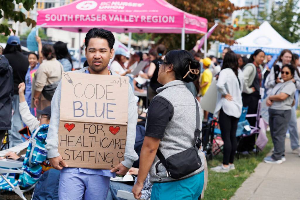 Nurses and other health-care workers walking the picket line outside of Surrey Memorial Hospital in Surrey on Thursday, July 9, 2026. (Anna Burns/ Surrey Now-Leader)