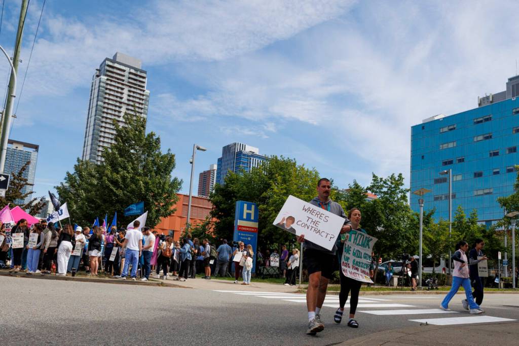 Nurses and other health care workers walking the picket line outside of Surrey Memorial Hospital in Surrey on Thursday, July 9, 2026. (Anna Burns/ Surrey Now-Leader)