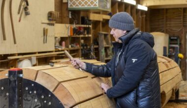 Indigenous artist Carey Newman working with Totem 2.0 in his workshop. (Courtesy Camosun College)