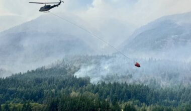 One of 12 helicopters assigned to the Brunswick Complex buckets a wildfire on Wednesday (July 8, 2026). (BCWS Photo)