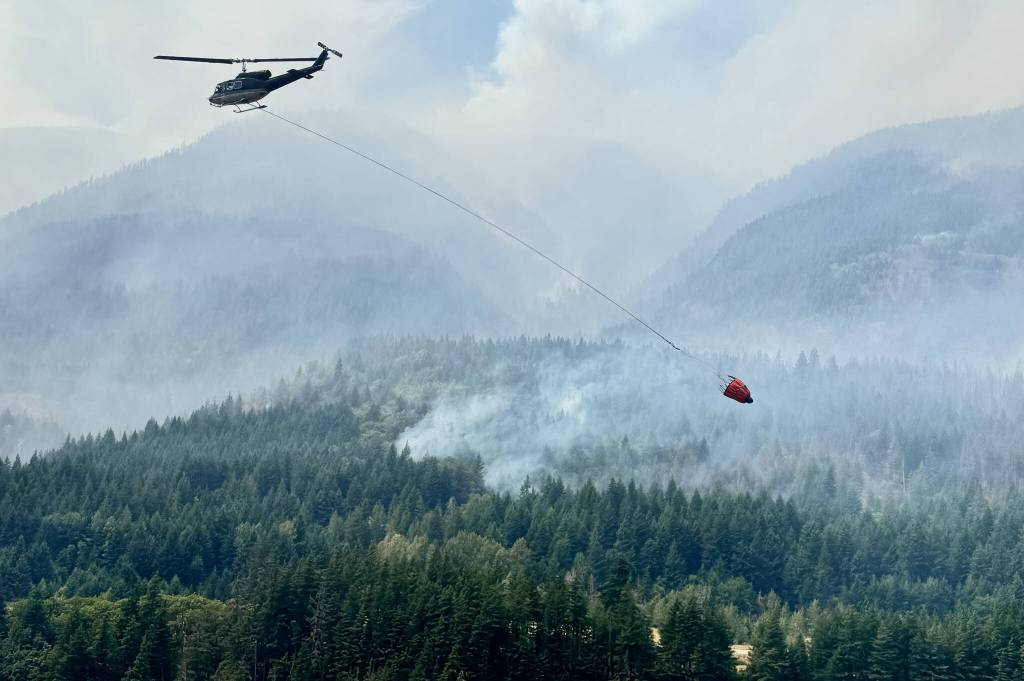 One of 12 helicopters assigned to the Brunswick Complex buckets a wildfire on Wednesday (July 8, 2026). (BCWS Photo)