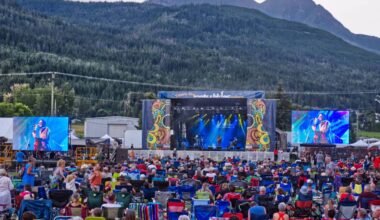 Dusk falls on the Salmon Arm fairgrounds as a large crowd of people enjoy a performance by Clerel at the ROOTSandBLUES Main Stage in 2022. (Observer file photo)