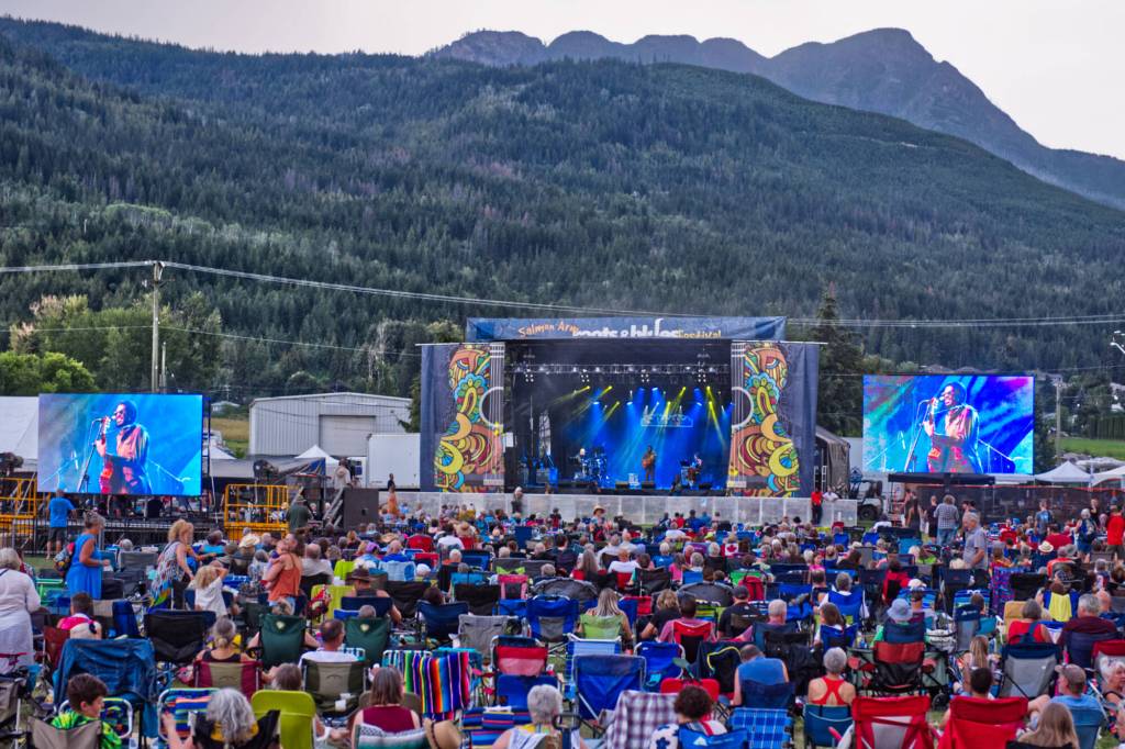 Dusk falls on the Salmon Arm fairgrounds as a large crowd of people enjoy a performance by Clerel at the ROOTSandBLUES Main Stage in 2022. (Observer file photo)