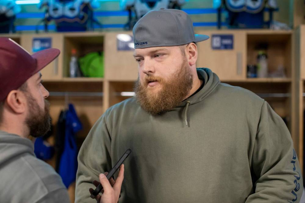 BROOK JONES/FREE PRESS
Winnipeg Blue Bombers offensive lineman Chris Kolankowski (right) talks to reporters in the Blue Bombers locker room after the 2024 season.
