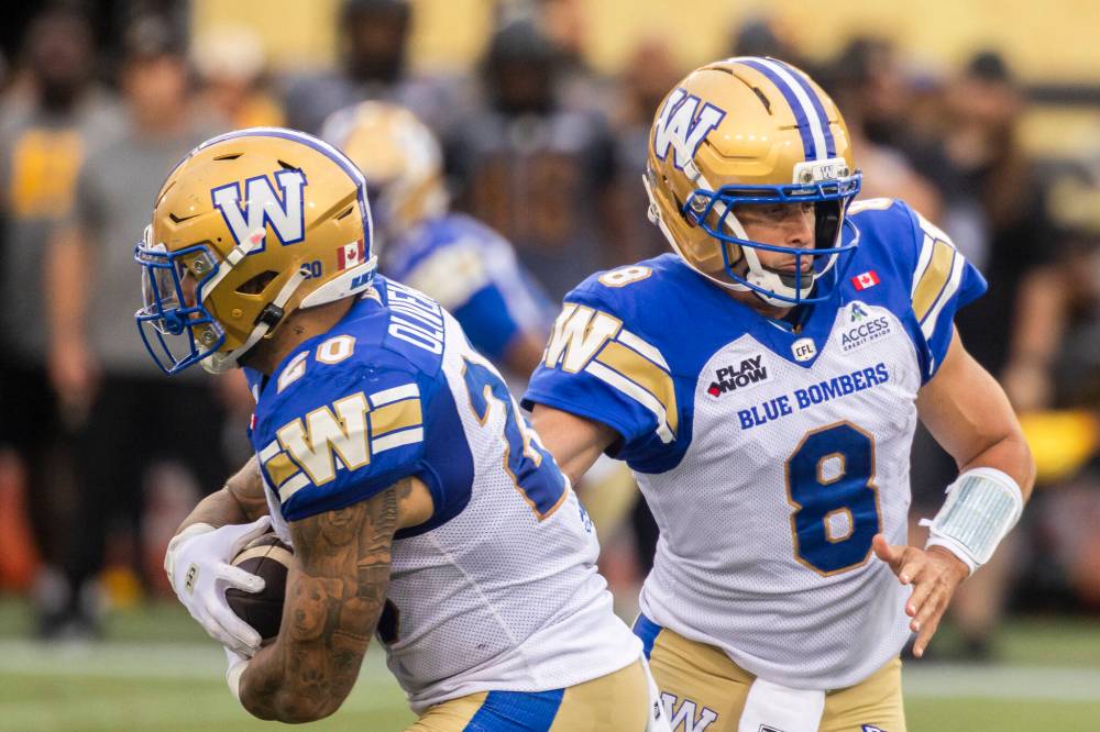 Nick Iwanyshyn / The Canadian Press
Winnipeg Blue Bombers quarterback Zach Collaros (right) is on the injury report with a neck issue and is listed as questionable for Friday’s date with the visiting Toronto Argonauts.