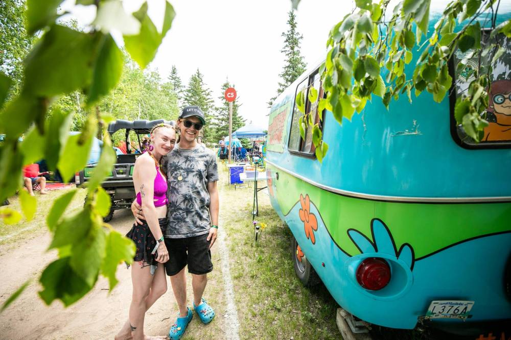 Photos by MIKAELA MACKENZIE / FREE PRESS
Stephanie Norris (left) and Logan Leclerc with their Mystery Machine-themed Boler camper in the festival campsite; the couple created a Scooby-Doo-themed site.