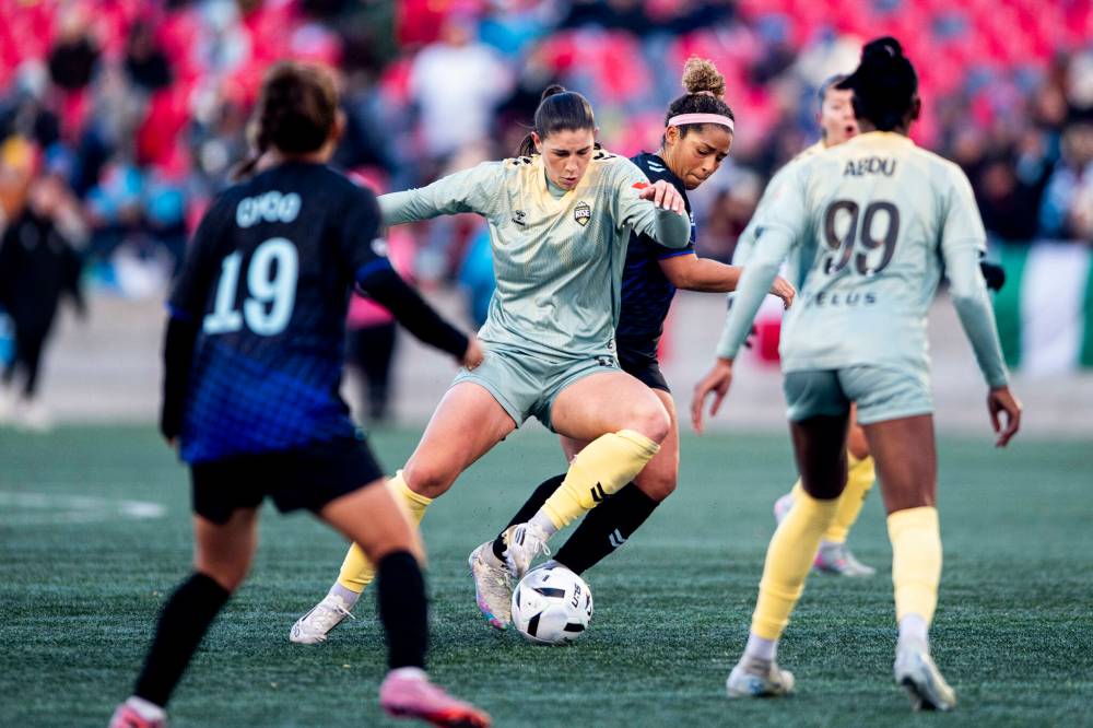Spencer Colby / THE CANADIAN PRESS FILES
Desiree Scott (centre right) plays for the Northern Super League’s Ottawa Rapid in 2025. Tuesday, the Olympic gold medalist helped announce the NSL’s expansion to Winnipeg, the seventh franchise in Canada’s rapidly growing professional women’s soccer league.