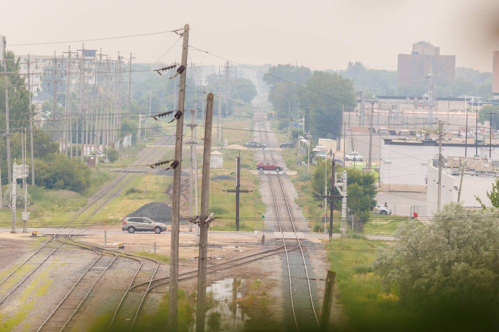 MIKE DEAL / FREE PRESS
A smokey view on Friday from the top of Garbage Hill in Westview Park looking south along the rail lines. The smoke is from forest fires in Northwestern Ontario.