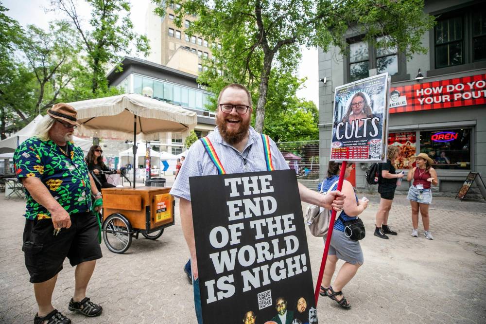 MIKAELA MACKENZIE / FREE PRESS Blair Moro promotes his show, CULTS, at the Fringe Festival kickoff at Old Market Square on Wednesday, July 15, 2026. Free Press 2026