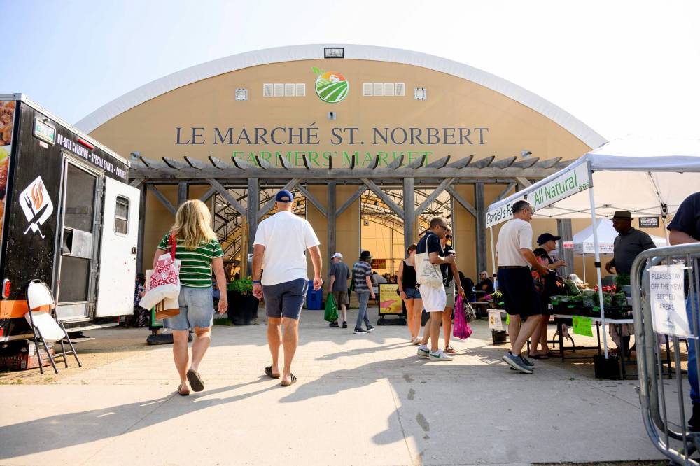 Mike Sudoma / Free Press
Shoppers approach the main entrance of the St. Norbert Farmers’ Market last Saturday morning.