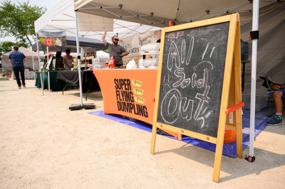 Mike Sudoma / Free Press
Signage at Super Flying Dumplings’ stand attests to its popularity.