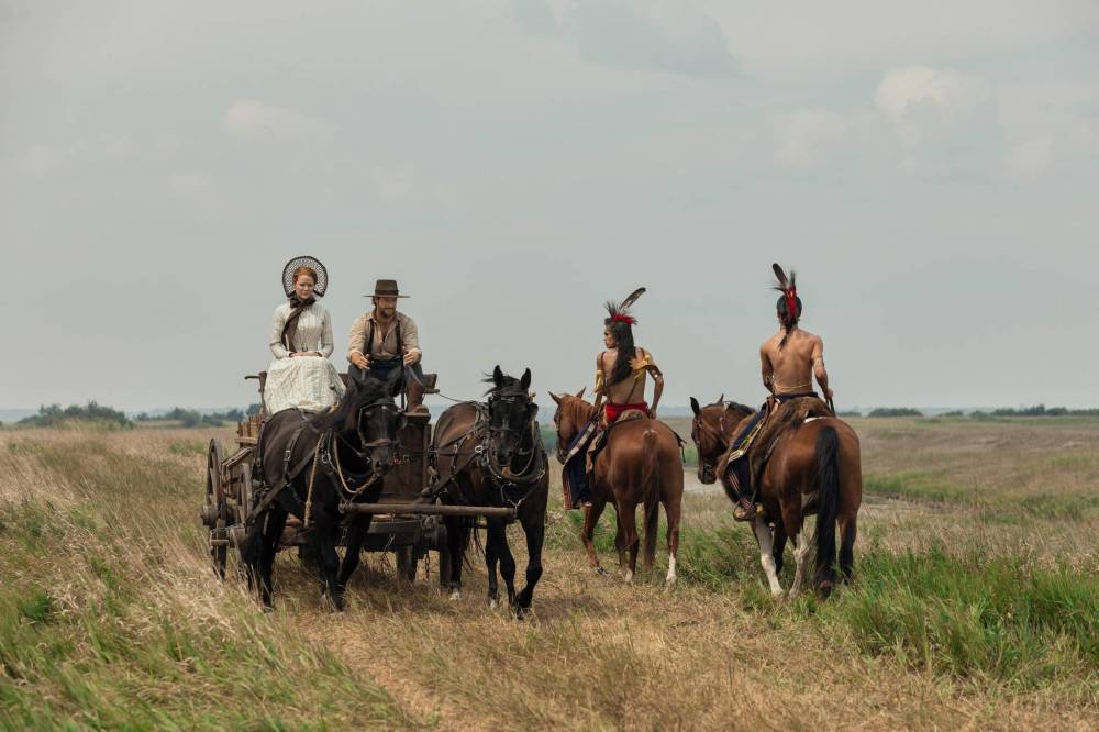 Eric Zachanowich / Netflix
From left: Crosby Fitzgerald as Caroline, Luke Bracey as Charles Ingalls, Corvin Mack as Myron, Xander Cole as Little Puma in Little House on the Prairie, which embraces the presence of the Osage in the American West.