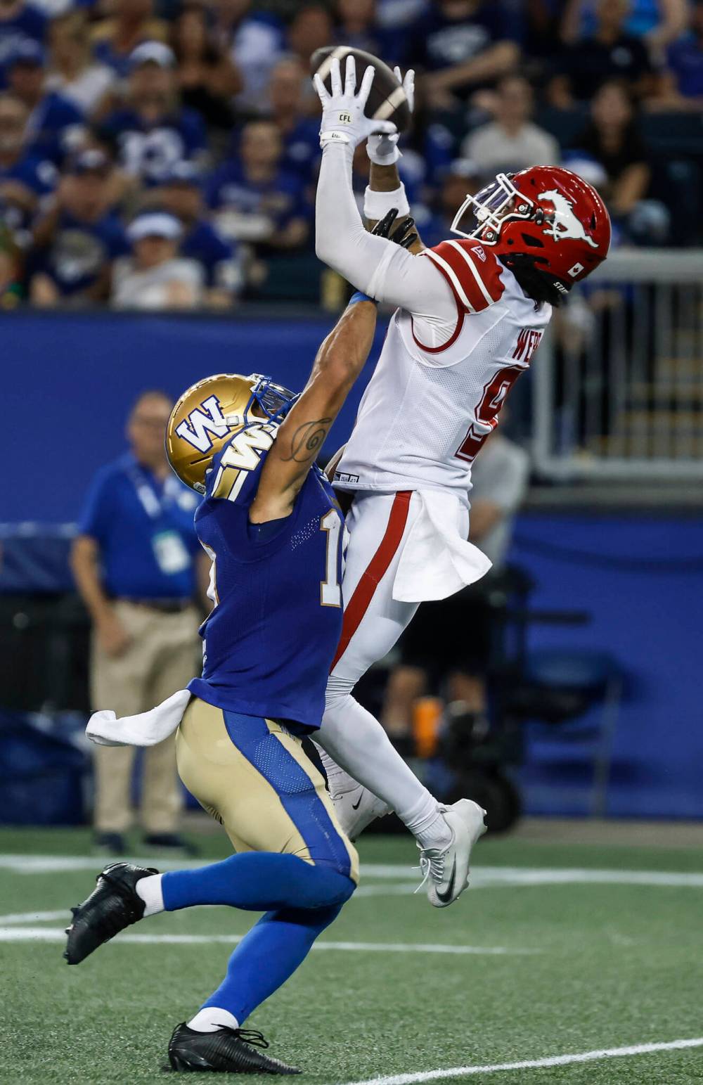 John Woods / THE CANADIAN PRESS
Calgary Stampeders’ Damon Webb (right) intercepts a pass intended for Winnipeg Blue Bombers receiver Nic Demski Friday night. The Bombers have thrown eight interceptions through seven games and have a league-leading nine fumbles on the season.