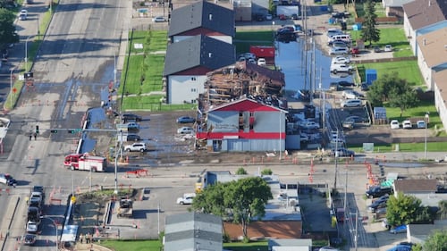 An aerial view of an apartment building at 82 Street and 132 Avenue in Edmonton the morning after a fatal fire on July 13, 2026. (Sean McClune / CTV News Edmonton)