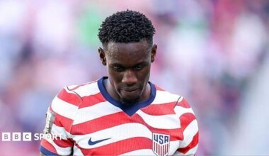Jarell Quansah walks off the pitch after being sent off during the World Cup 2026 match between Mexico and England