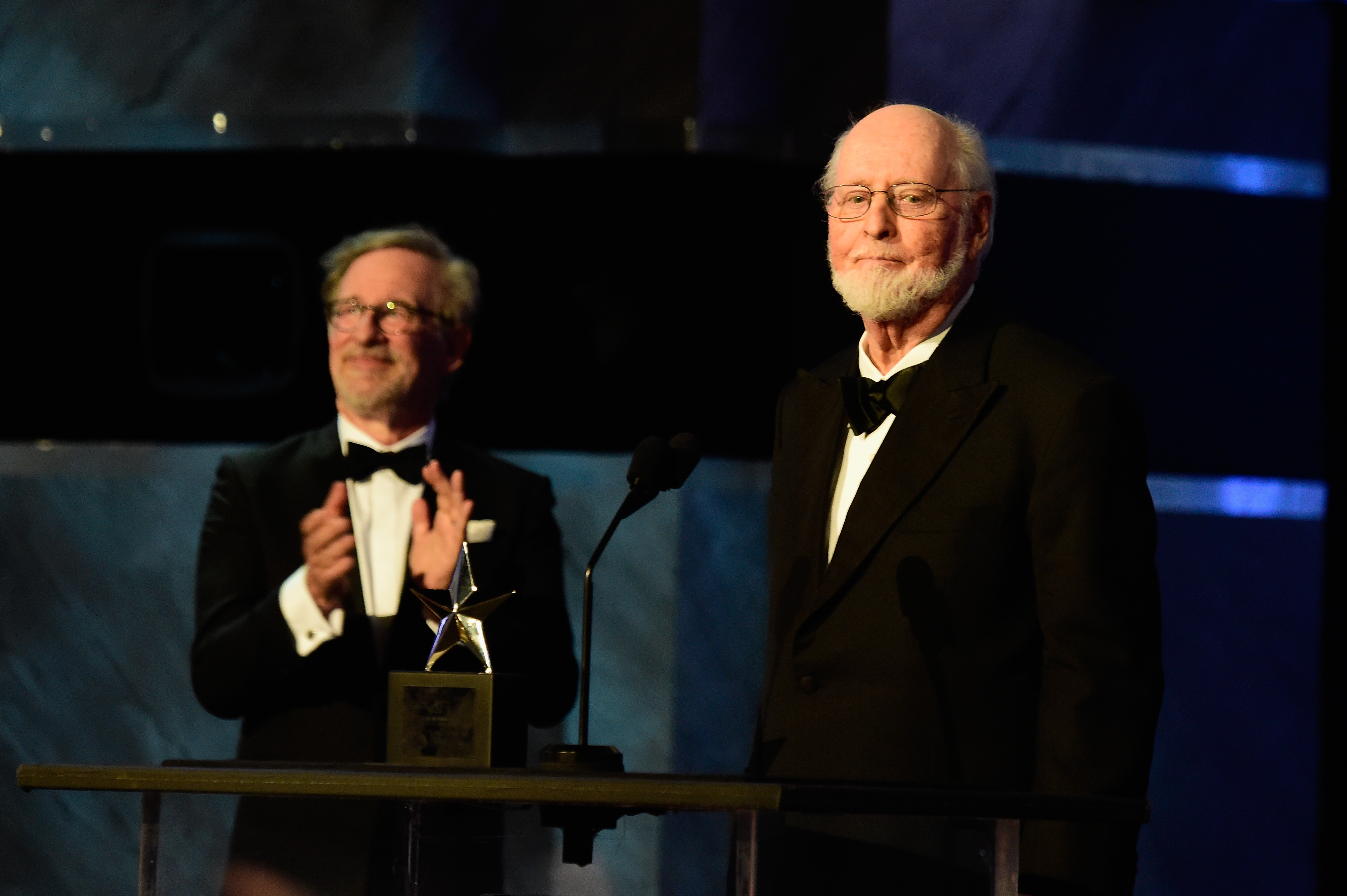 HOLLYWOOD, CA - JUNE 09:  Director Steven Spielberg (L) and Honoree John Williams (R) onstage during American Film Institutes 44th Life Achievement Award Gala Tribute show to John Williams at Dolby Theatre on June 9, 2016 in Hollywood, California. 26148_001  (Photo by Frazer Harrison/Getty Images for Turner)