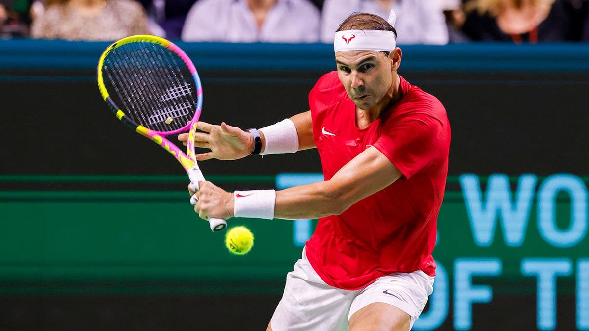 Rafael Nadal hits a backhand.