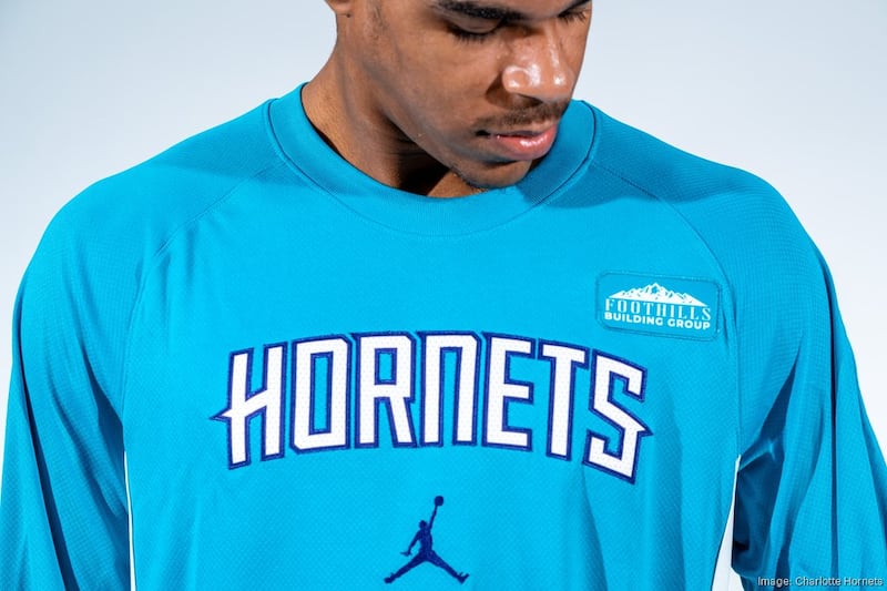 Hornets warmup shirt patch Foothills Building Group