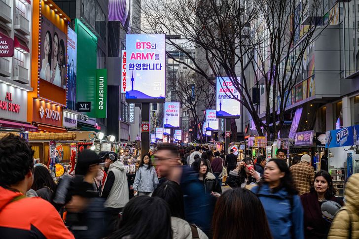 Digital billboards in Seoul's Myeong-dong, Jung District, displays a welcome message for BTS' fan club, ARMY, ahead of the group's Gwanghwamun comeback concert, March 18. Korea Times photo by Shim Hyun-chul