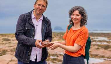 Prof Chris Lintott and Dr Claire Cousins on the beach at Milsey Bay in North Berwick looking for reduction spots in rock.