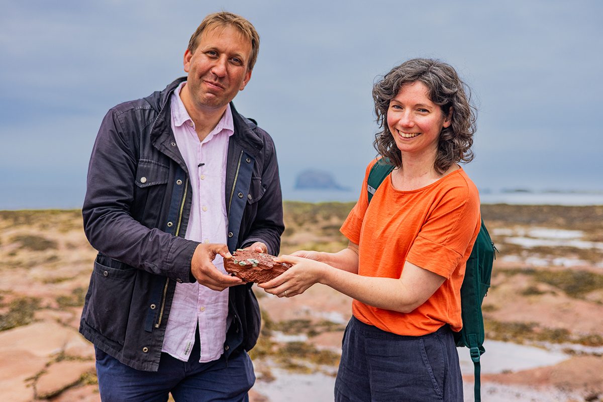 Prof Chris Lintott and Dr Claire Cousins on the beach at Milsey Bay in North Berwick looking for reduction spots in rock.